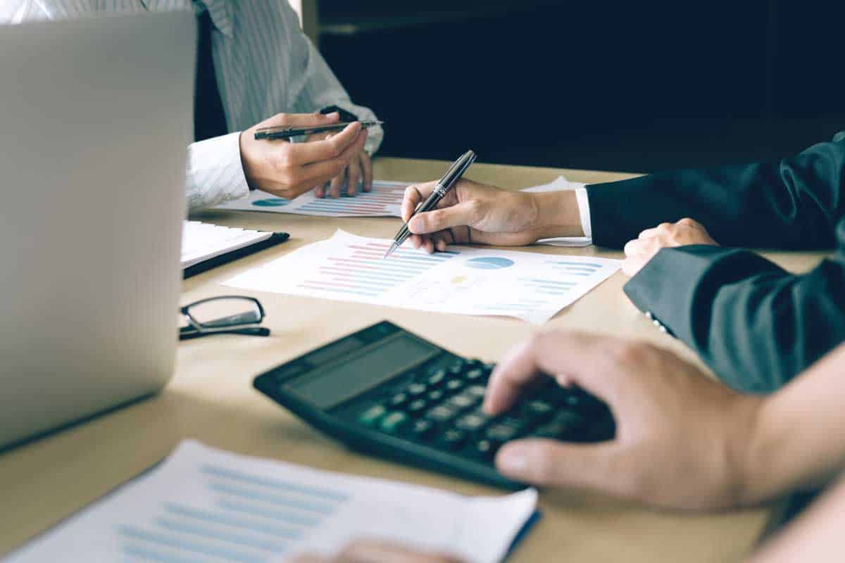 financial officers performing a company audit in a meeting
