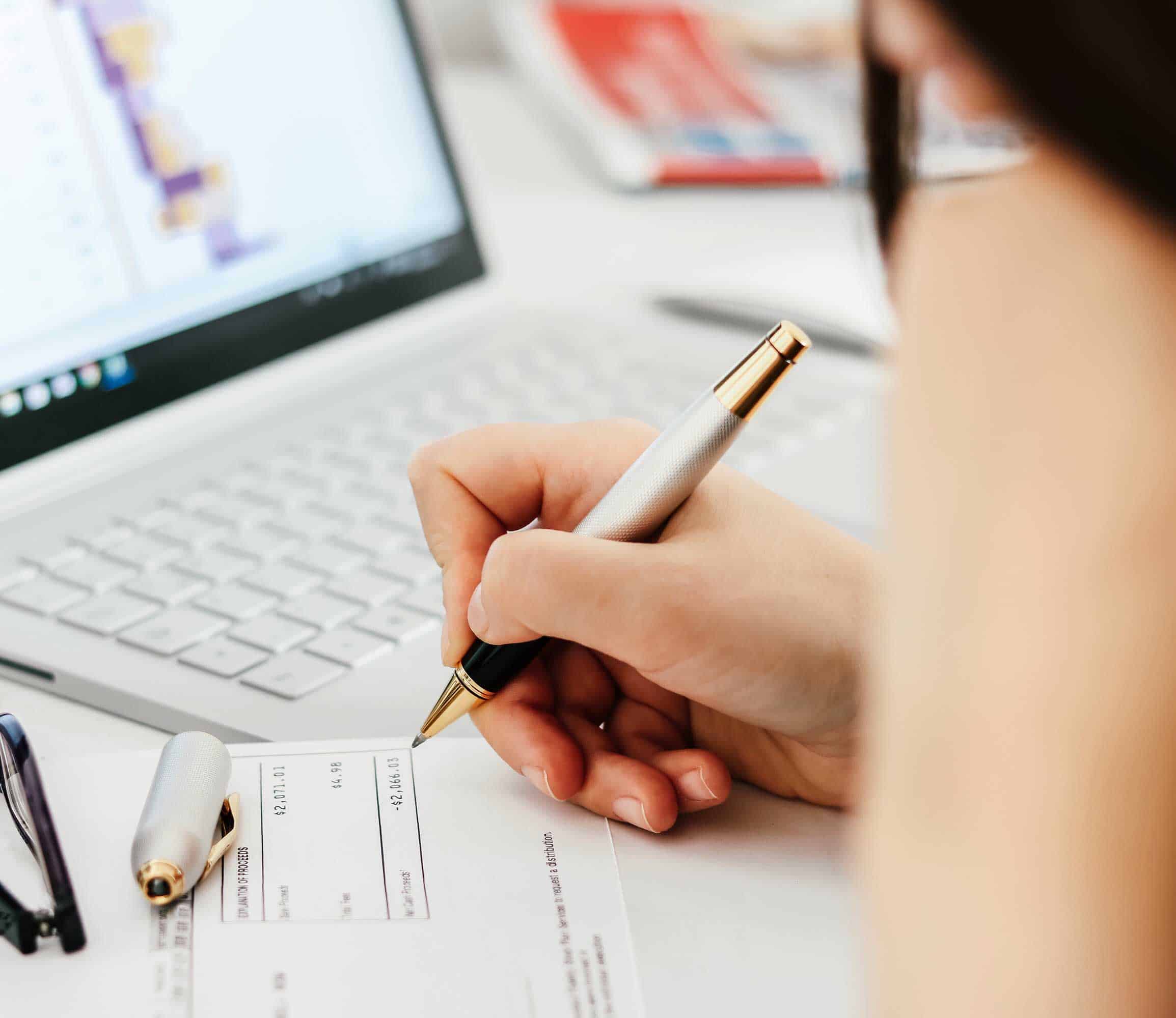 corporate officer calculating company profits in an example of capital gains tax in Singapore